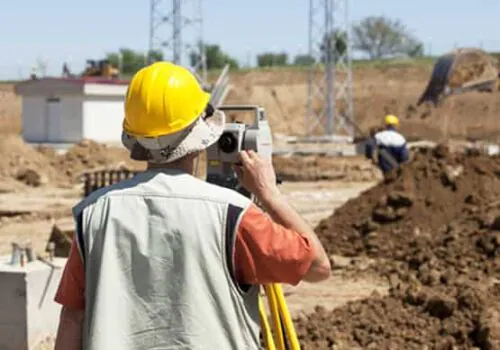 A professional civil engineer performing land surveying services in Illinois