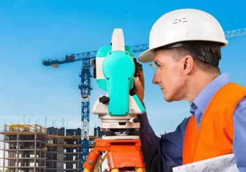 A civil engineer performing commercial survey services on site in Illinois