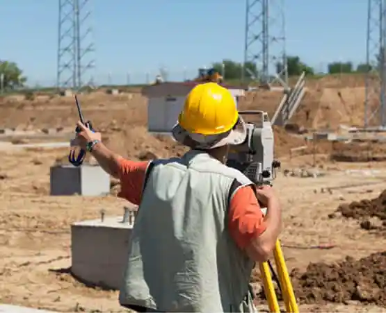 A civil engineer performing Land Survey Services in East Peoria IL