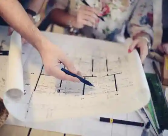 Engineers Davenport IA 1 Engineers Davenport IA going over the floorplan design for an apartment complex