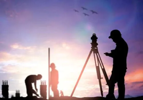 Land Surveyors in silhouette