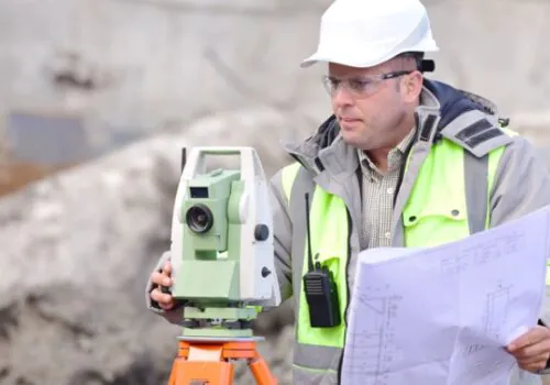 A worker surveying a site as a part of Civil Engineering in Illinois