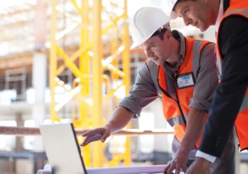 Two contractors discussing ALTA Surveys from Austin Engineering