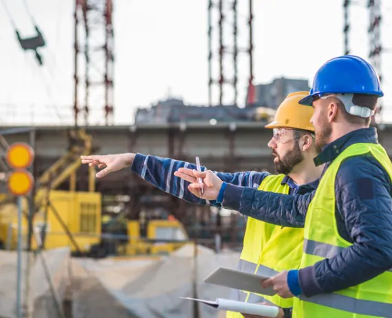 Contractors on a construction site performing ALTA Surveys in Peoria IL