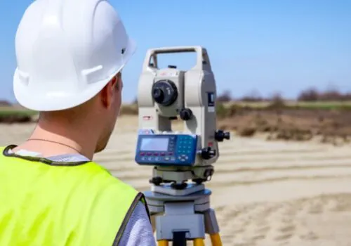 A Property Surveyor in Illinois checking land before purchase