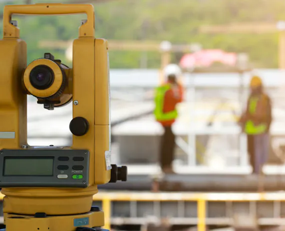 Property surveyors setting up to perform ALTA Surveys in Moline IL 