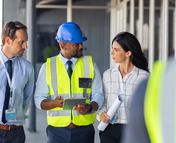 Civil engineering talking with contractors about Commercial Site Planning in Knoxville TN