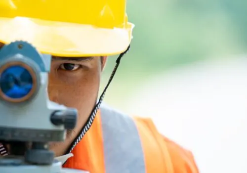 A civil engineer performing land surveys in Illinois