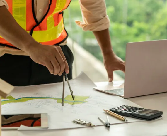 A engineering writing up a site plan after Land Surveys in Springfield IL