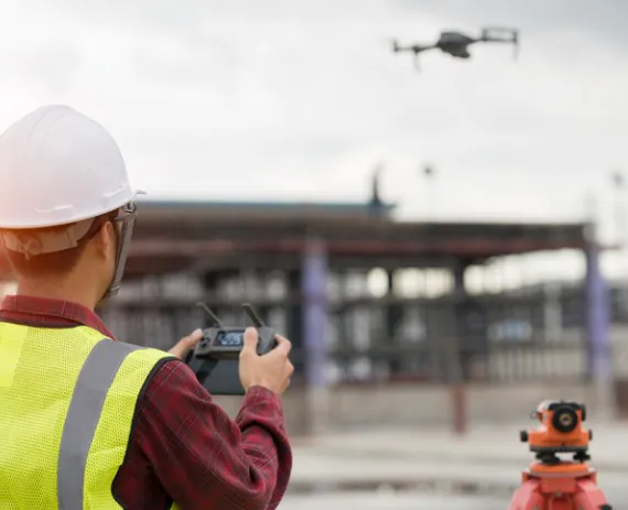 A man piloting a drone for conducting Drone Surveys in Springfield IL 