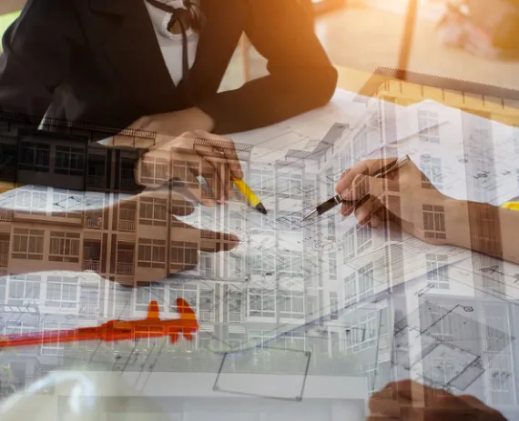 double exposure of a building and engineers reviewing a print for Site Planning in Hamilton County TN 