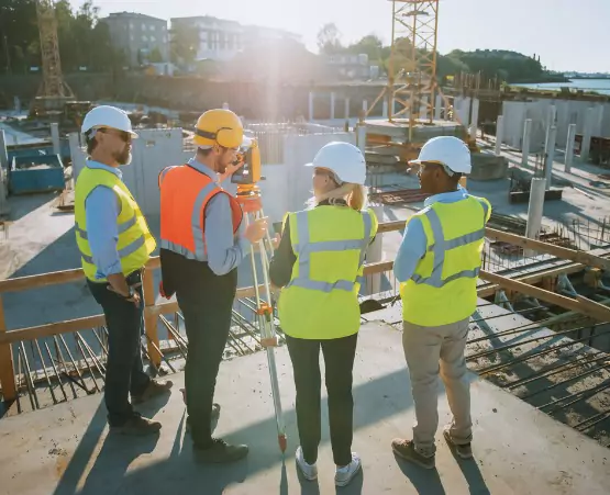 Drone Surveys Davenport IA 2 A team of land surveyors at a construction site, conducting Surveys in Davenport IA