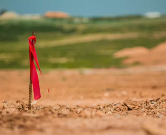 Stakes on a construction site, after Site Layout Surveys Peoria IL