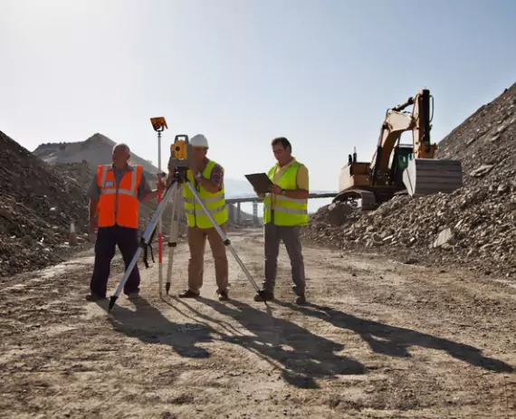 Construction site being staked out with Site Layout Surveys in Peoria IL
