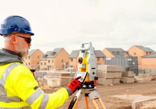 A civil engineer performing a site layout survey