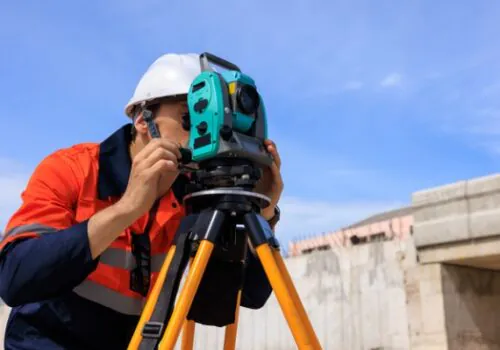 An engineer performing commercial surveys in Iowa while on a construction site
