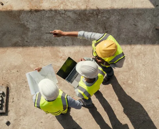 A team from Austin Engineering reviews an engineering project, which is one of the offerings from the company in addition to Commercial Surveys in Moline IL