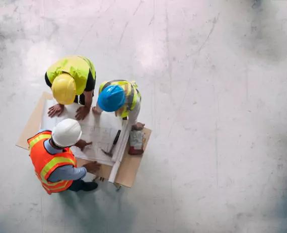 Survey Crews Bloomington IL 1 A team of engineers from Austin Engineering review commercial plans. As civil engineers, the company also has Survey Crews in Bloomington IL for hire.