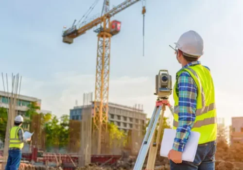 An member of one of Austin Engineering's Survey Crews in Bloomington IL inspects a job site
