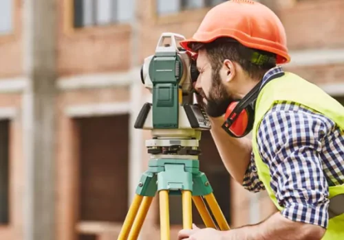 A team member from Austin Engineering provides Commercial Surveys in Champaign IL