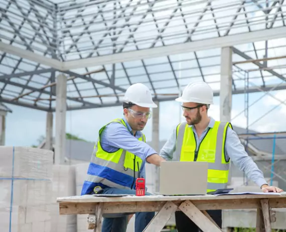 Engineers from Austin Engineering go over the plans for a commercial project after the team provided Commercial Surveys in Champaign IL
