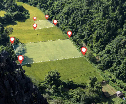 An aerial view of land with the boundaries illustrated, a representation of boundary surveys