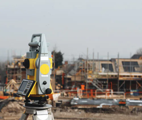 Close-up of Land surveyors equipment while performing ALTA & NSPS Land Title Surveys